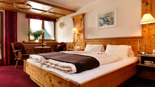 alpina-and-more-apartments-serfaus-sommerurlaub-winterurlaub-outdoorpool-doppelbett-sitzgelegenheit-ambiente.jpg